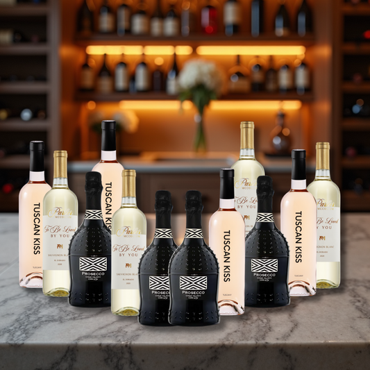 Collection of Tuscan Kiss wine bottles on a bar counter with a blurred bar background.
