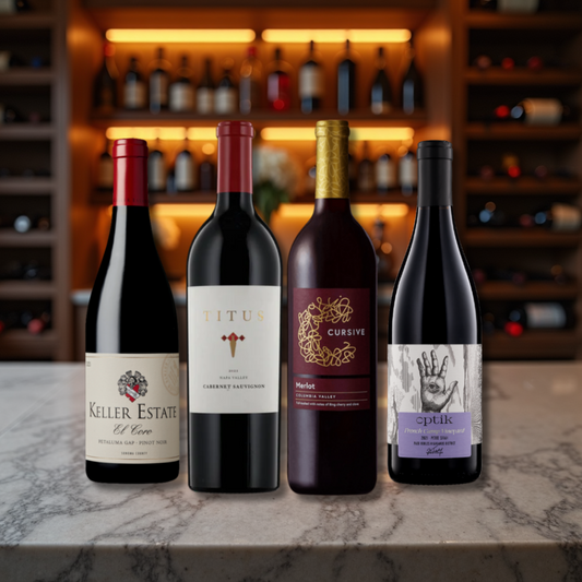 Four wine bottles on a marble surface with a bar setting in the background