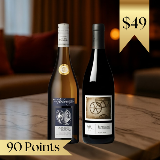 Two wine bottles on a table with a blurred background and price tag.