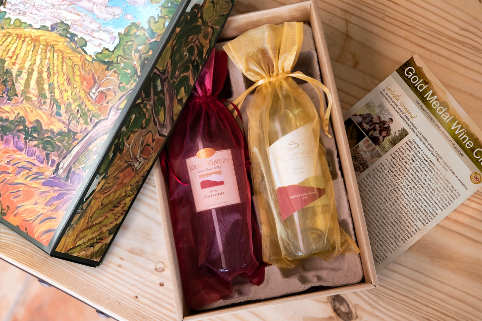 Artist Gift Box opened with two bottles of wine elegantly wrapped